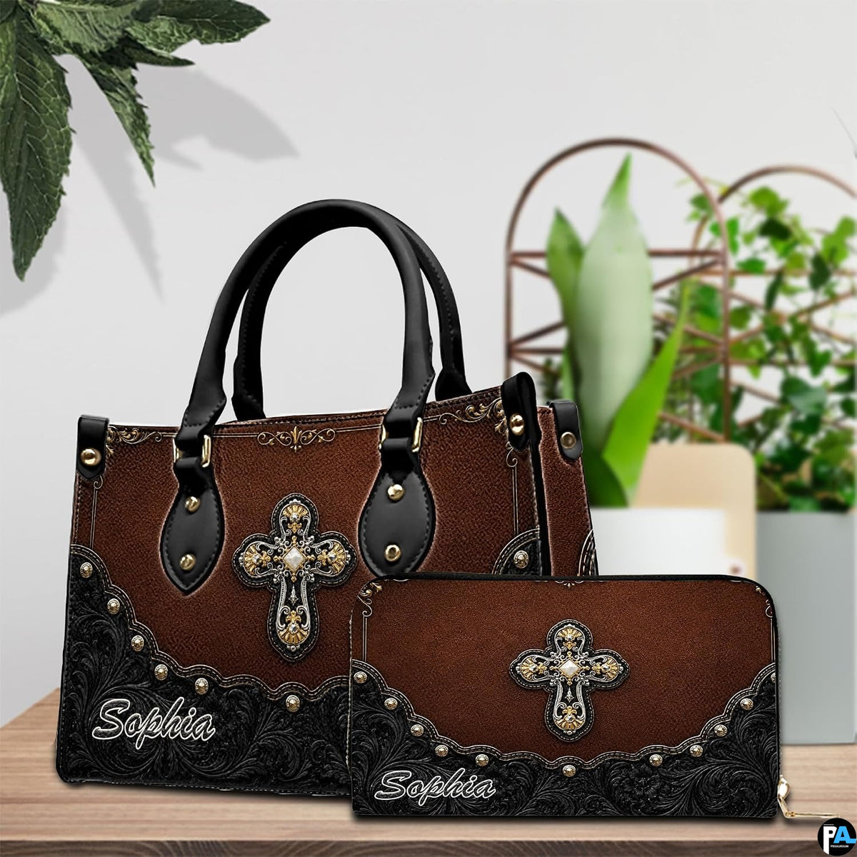 Detailed view of ornate filigree cross centerpiece and textured chestnut background on handbag.