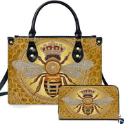 Crowned honey bee handbag and matching wallet set with golden honeycomb pattern.