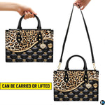 Rear angle of leopard print and quilted black handbag displaying seamless pattern layout.