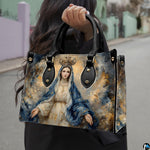 Outdoor lifestyle photo of model carrying crowned Virgin Mary handbag on street
