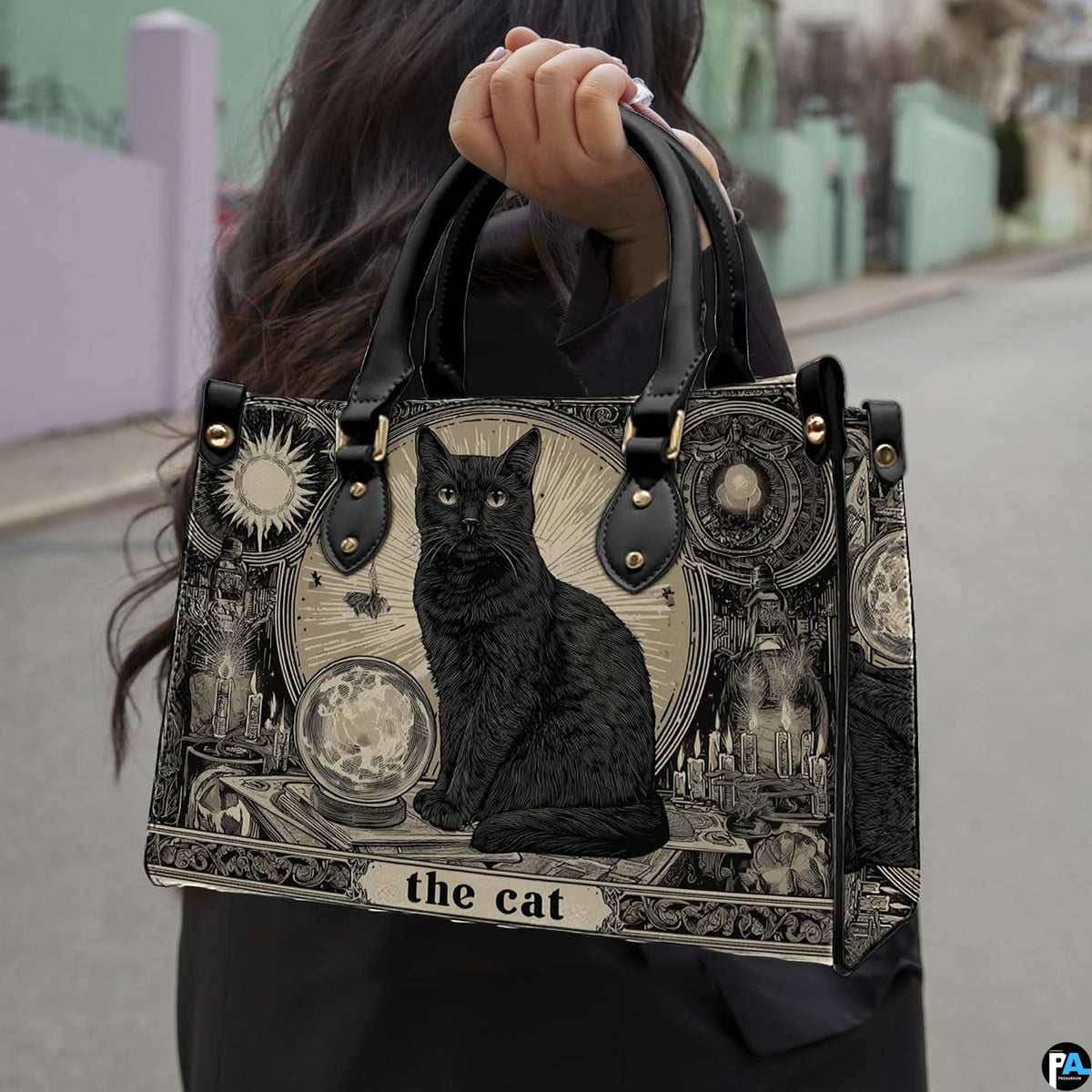 Model walking outdoors holding the black cat tarot card art printed creation.