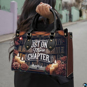 Antique bookshelf handbag held by dual top handles outdoors, showcasing dark academia library graphics.