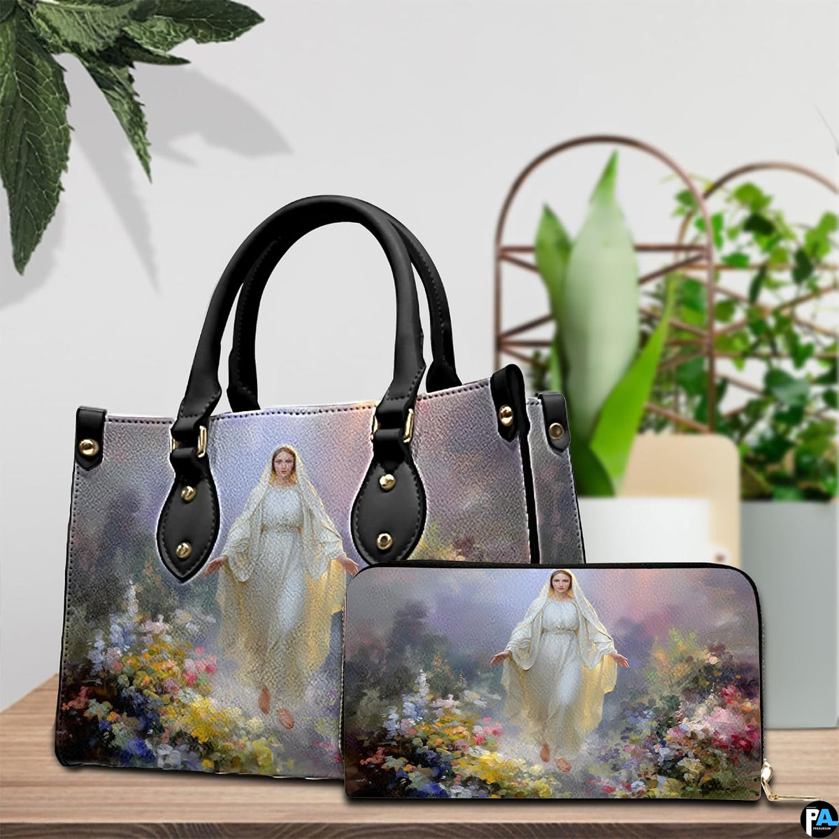 Our Lady of Grace handbag and matching zippered wallet displayed on wooden table.