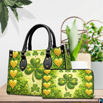 Green clover handbag and wallet with gold hearts on a tabletop