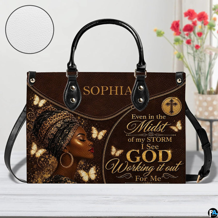 Brown and gold woman portrait handbag with butterfly accents and decorative script styling