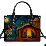 Close-up front view of holy family at the manger inside illuminated stable on structured tote handbag