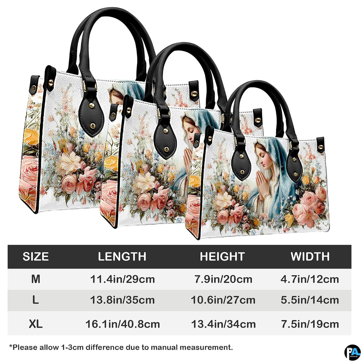 White floral devotional handbag displayed on wooden plank tabletop with warm background bokeh.