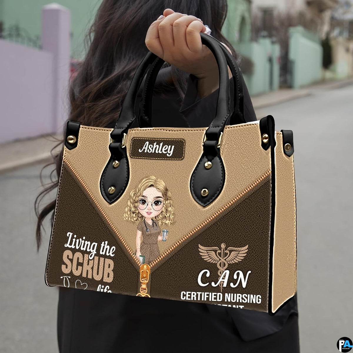 Chibi nursing assistant handbag held outdoors showing visual scale against street setting.