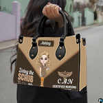 Chibi nursing assistant handbag held outdoors showing visual scale against street setting.