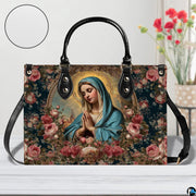 Devotional Madonna handbag on wooden tabletop with white texture swatch and flowers