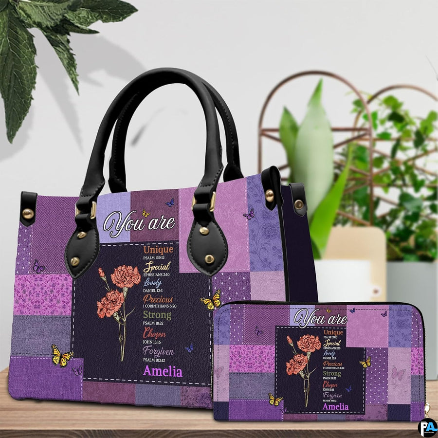 Side view of purple patchwork purse highlighting decorative flower graphics.
