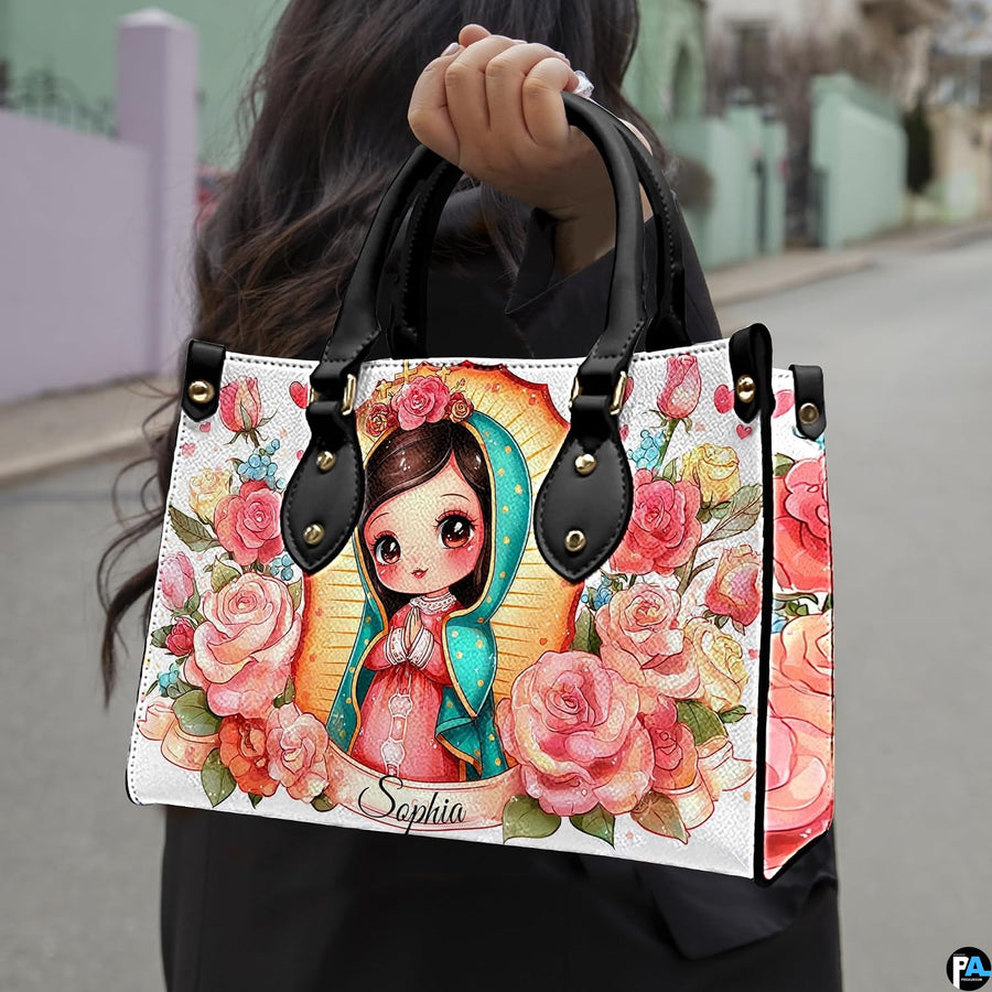 Outdoor lifestyle photo of chibi Guadalupe handbag carried over the arm on a street sidewalk.