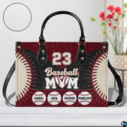 Alternative view displaying baseball handbag with dark trim and vibrant red lace graphics.