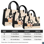 Side perspective view of peeking cats handbag and wallet showing structured profile