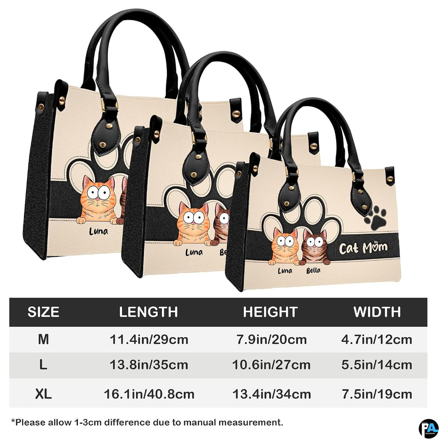 Side perspective view of peeking cats handbag and wallet showing structured profile