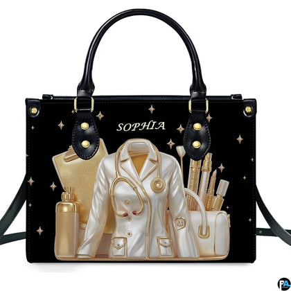 Front view of black doctor handbag featuring golden stethoscope and physician lab coat artwork
