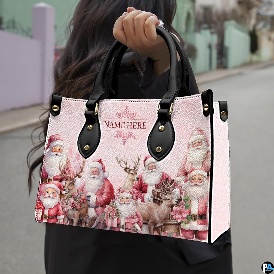 Model holding vintage Santa handbag outdoors by dual black top handles, displaying scale.