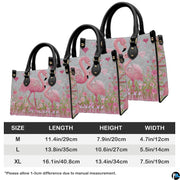 Back view of pink flamingo handbag showing coordinated floral detailing.