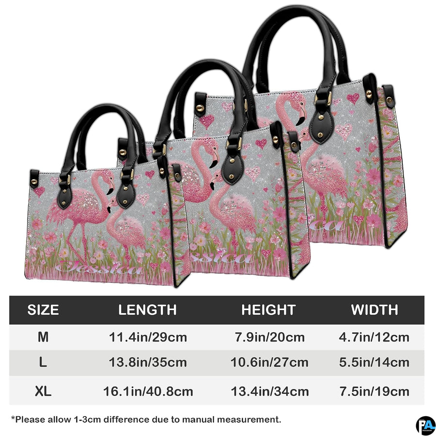 Back view of pink flamingo handbag showing coordinated floral detailing.