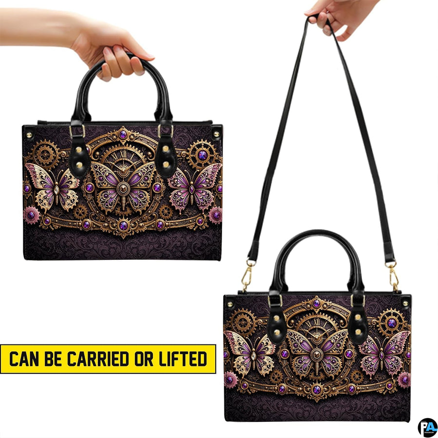 Bottom view of steampunk butterfly handbag showing protective gold base hardware