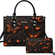 Glowing firefly handbag and matching wallet set displayed against a plain white studio background.