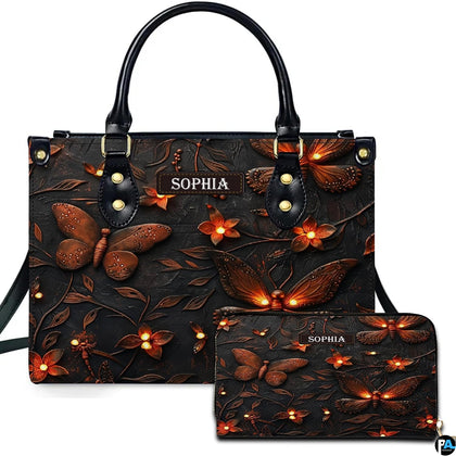 Glowing firefly handbag and matching wallet set displayed against a plain white studio background.