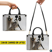 Two carrying views of book page dress handbag