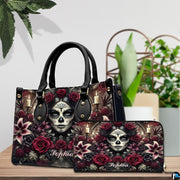 Sugar skull handbag and wallet on wooden table beside houseplant and wire trellis.