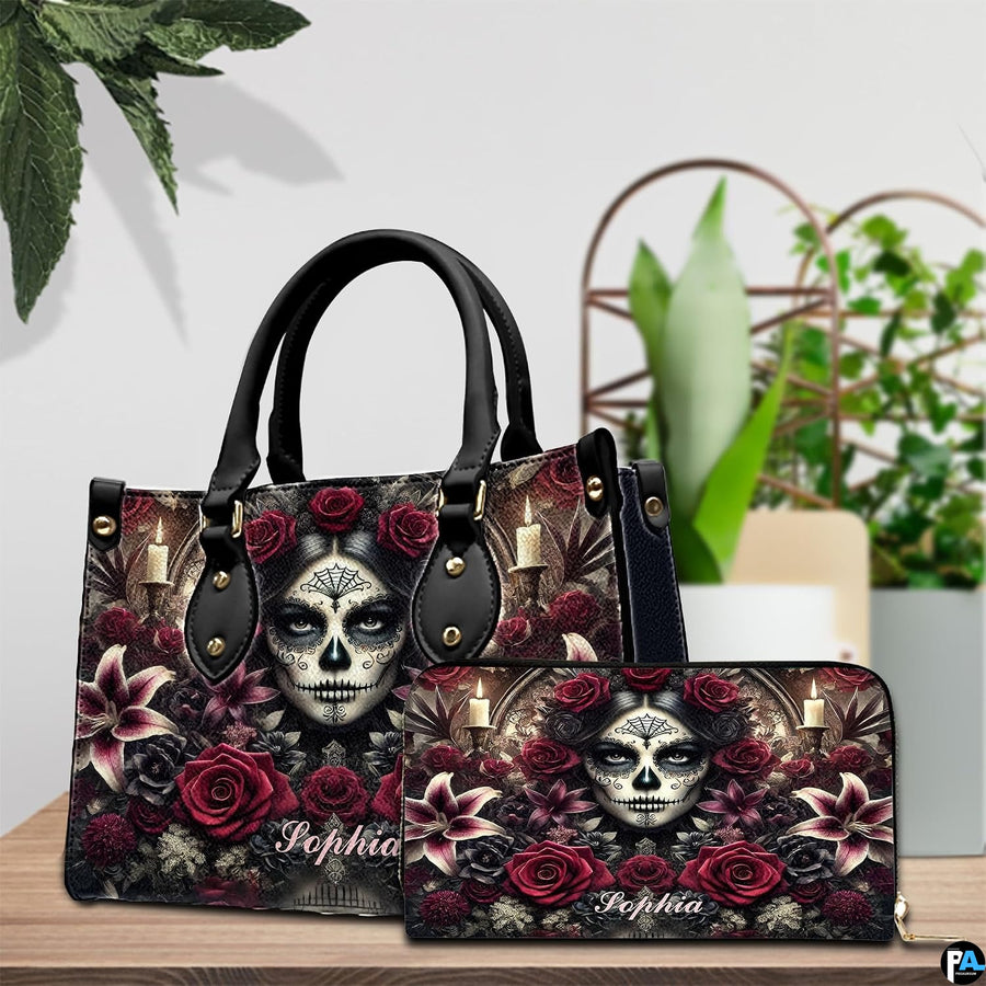 Sugar skull handbag and wallet on wooden table beside houseplant and wire trellis.