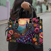 Woman carrying a vivid peacock handbag with flowers and mountain sunset artwork