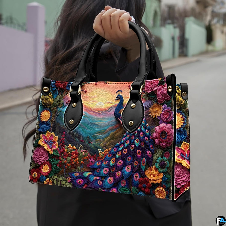 Woman carrying a vivid peacock handbag with flowers and mountain sunset artwork