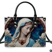 Front view of handbag featuring porcelain Madonna portrait surrounded by jeweled medallion and blue roses.