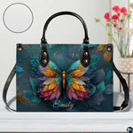 Top down view of butterfly handbag displaying spacious interior opening