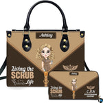 Chibi nursing assistant handbag and matching wallet set displayed upright on white background.