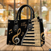 Frontal view of musical piano artwork positioned on wooden table before cafe window.