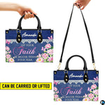 Side perspective of denim floral handbag displaying structured shape