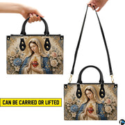 Virgin Mary sacred heart handbag presented on natural wooden tabletop