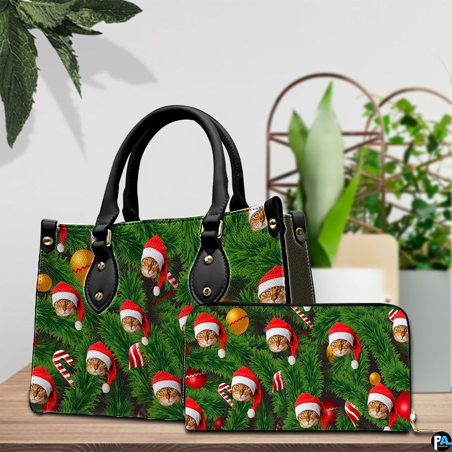 Holiday handbag placed beside matching evergreen Santa cat zippered wallet in front of houseplant