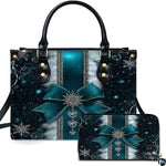 Front view of teal snowflake bow handbag and matching zippered wallet with silver holiday charms.