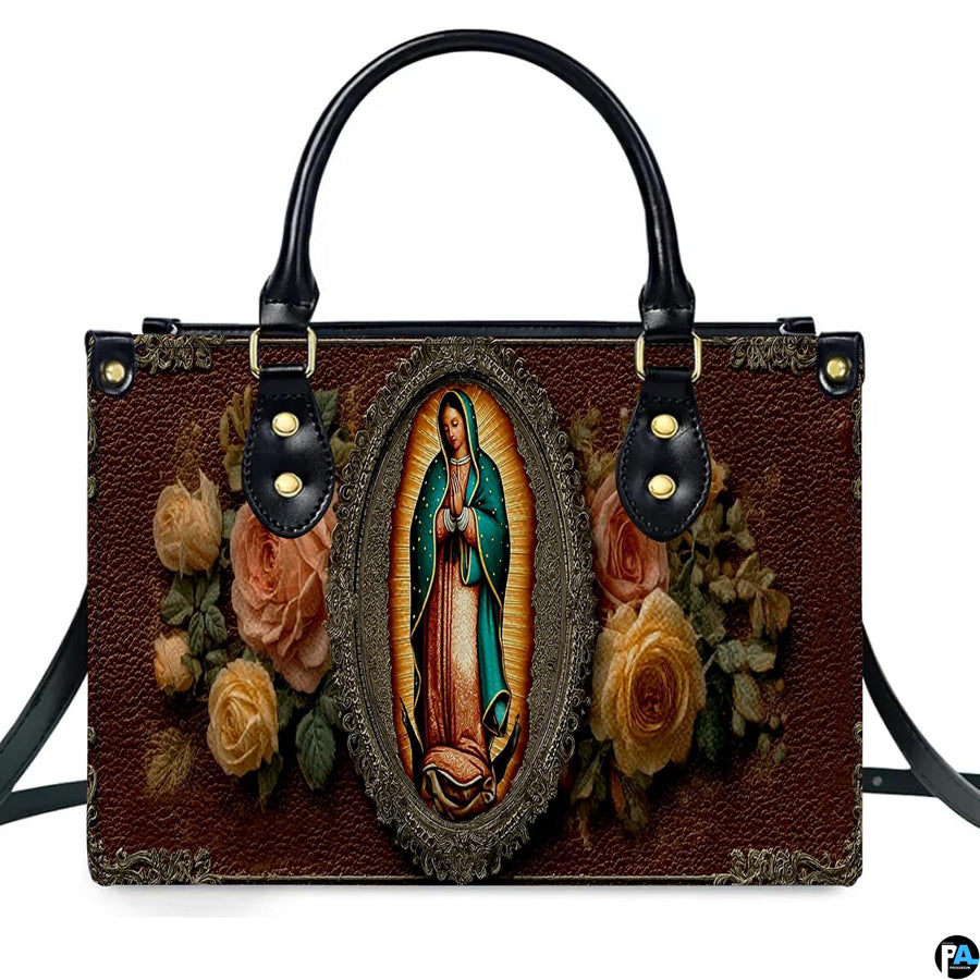 Close-up view of Virgin of Guadalupe icon within ornate golden filigree oval frame