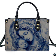 Front view of monochrome blue Virgin Mary and infant Jesus handbag on white background