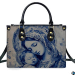 Front view of monochrome blue Virgin Mary and infant Jesus handbag on white background