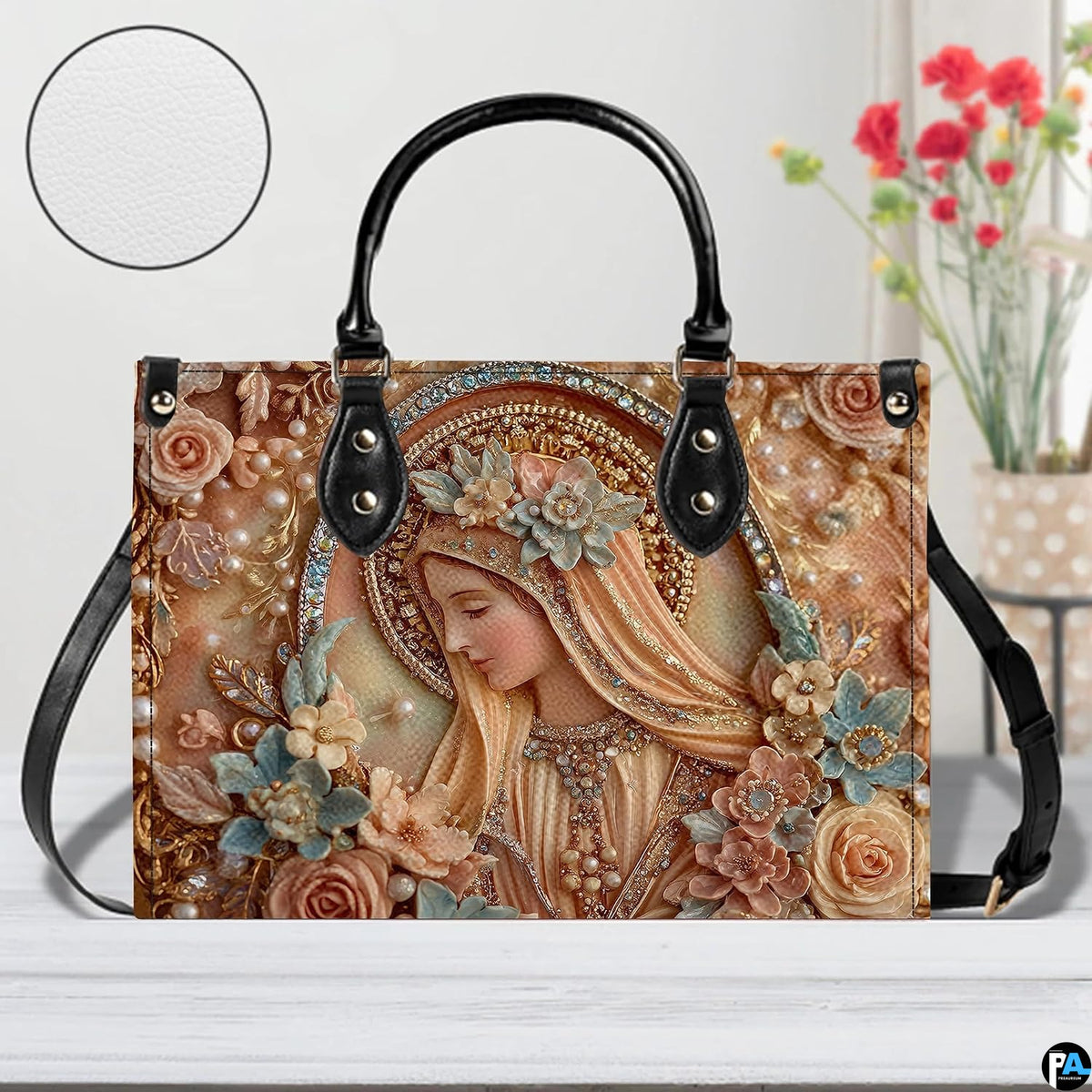 Handbag displayed outdoors in daylight showing delicate sculpted peach floral details.