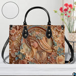 Handbag displayed outdoors in daylight showing delicate sculpted peach floral details.