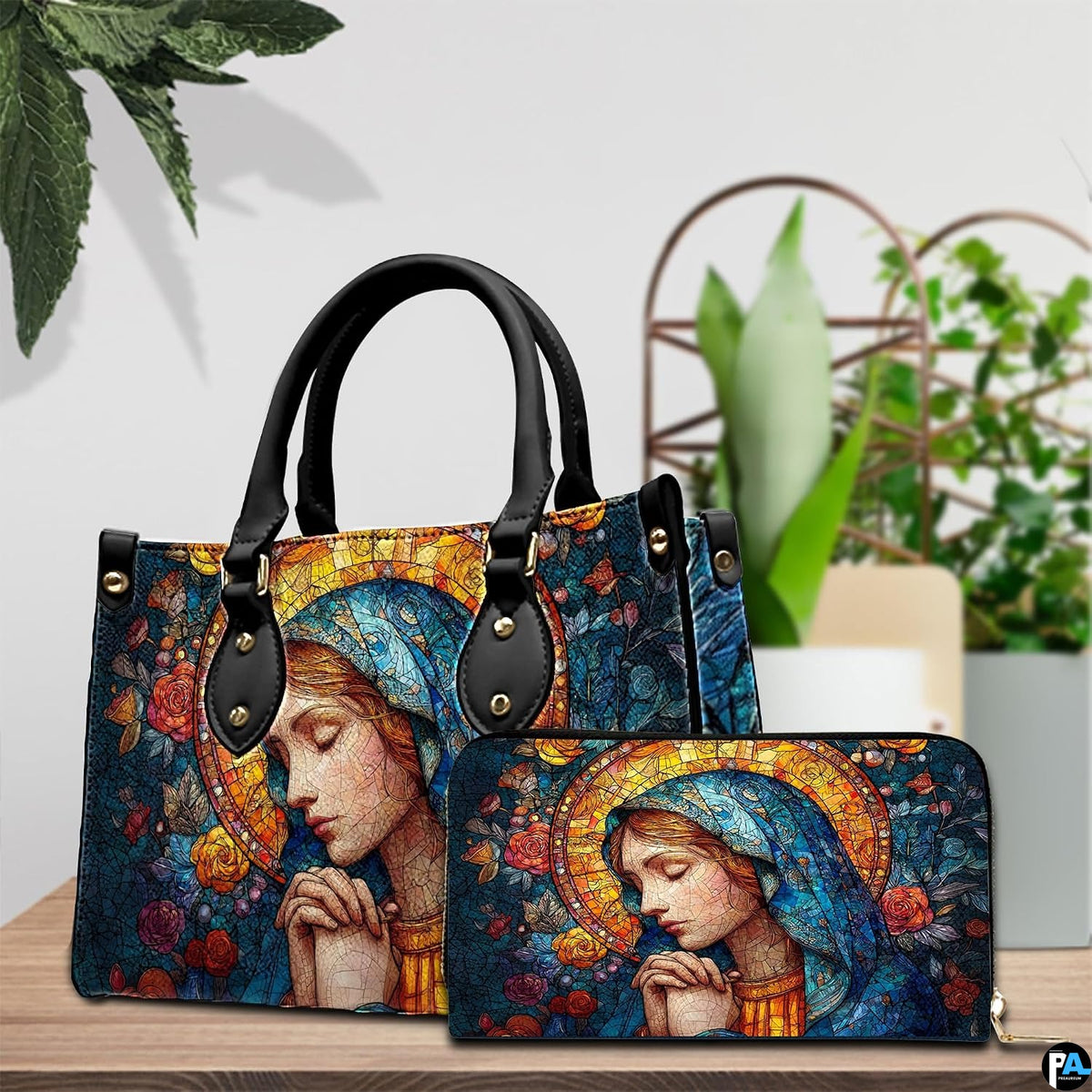 Turquoise veil Mary handbag and continental wallet displayed together on tabletop.