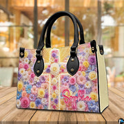 Floral cross handbag displayed on rustic wooden table in cafe setting.
