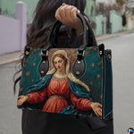 Lifestyle demonstration of the celestial Madonna handbag held outdoors