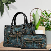 Side profile of bronze dragonfly handbag showing continuous patina teal and baroque border along gusset