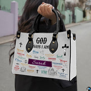 Outdoor street photo of person carrying scripture affirmation faith handbag.