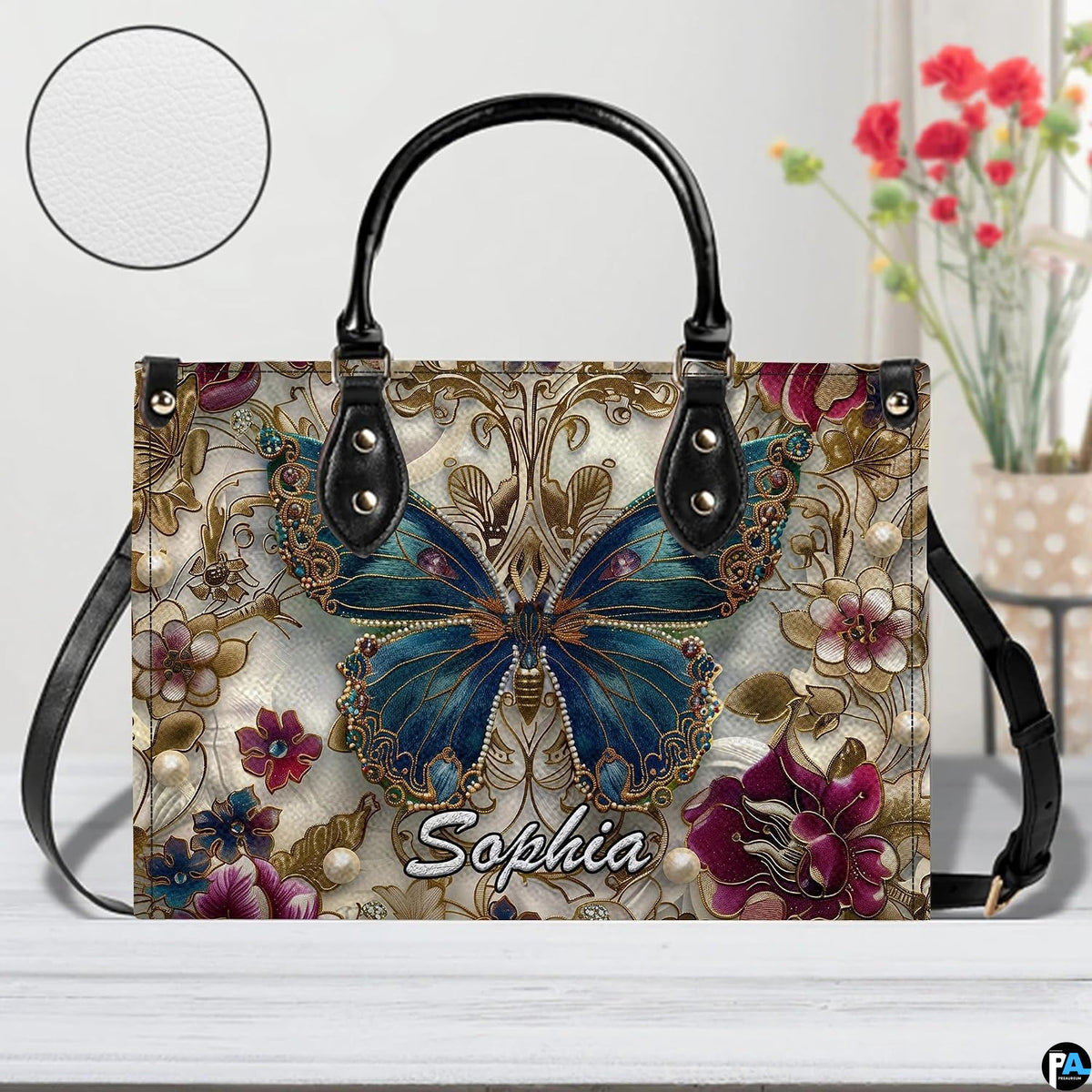 Close-up front view of matching zippered wallet showing baroque butterfly